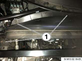 Remove screws (1) for the upper bulkhead cover